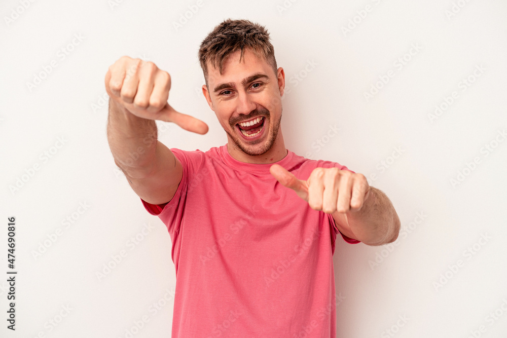 Fototapeta premium Young caucasian man isolated on white background unhappy looking in camera with sarcastic expression.