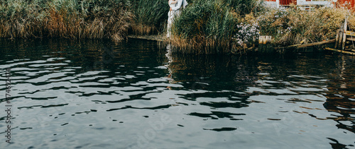 young wedding couple from Brazil happy together, grey suite and white slim dress