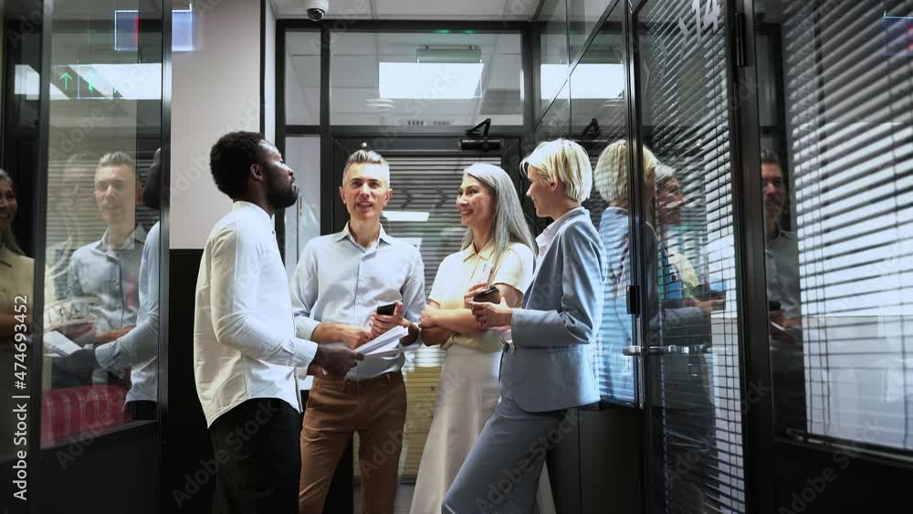 Multiethnic business people working in a start up office Multiethnic business people working in a start up office
