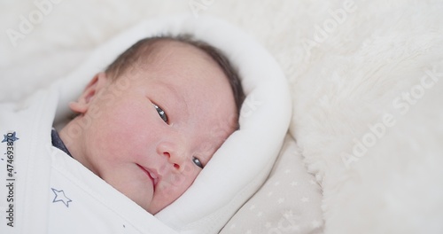 close up portrait face of cute lovely little newborn baby infant sleeping at home, Happiness Newborn Baby at Comfortable Home in Day Lighting Indoors 