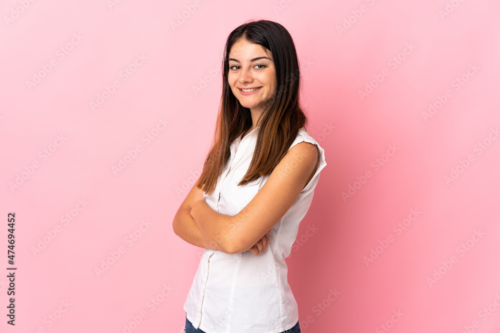 Young caucasian woman isolated on pink background with arms crossed and looking forward Young caucasian woman isolated on pink background with arms crossed and looking forward