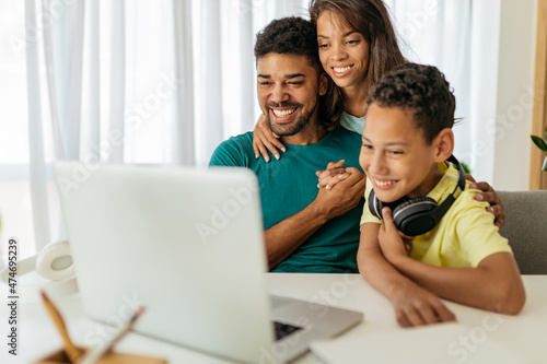 African American family having video call with friends