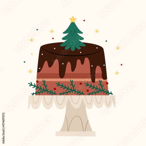 Christmas cake in chocolate decorated with a Christmas tree. Traditional Christmas sweets.