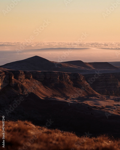Photography of the canyon in the morning. Beautiful sunrise and nature. Mountains above the clouds. Russian nature.