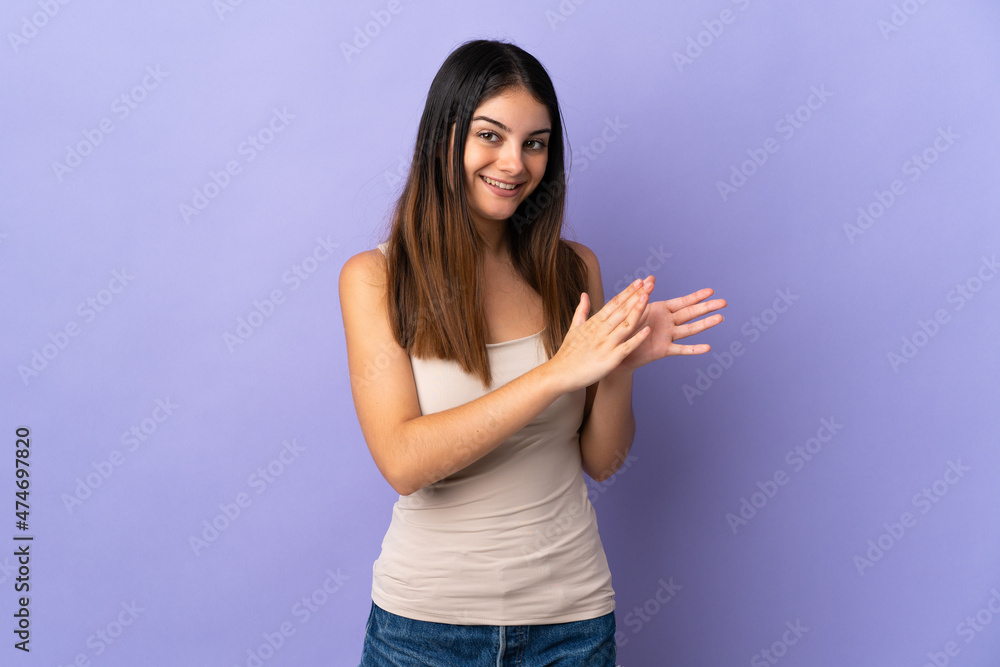 Young caucasian woman isolated on purple background applauding Young caucasian woman isolated on purple background applauding
