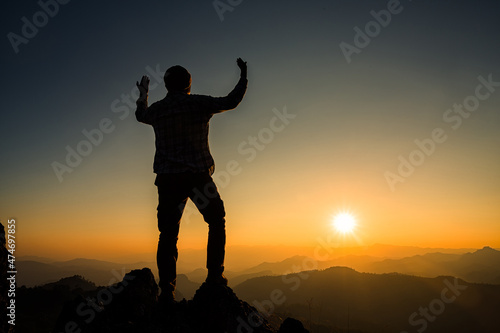 Silhouette of christian man hand praying