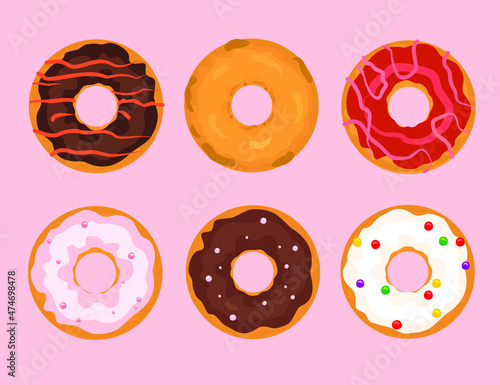 A set of colorful donuts on a pink background