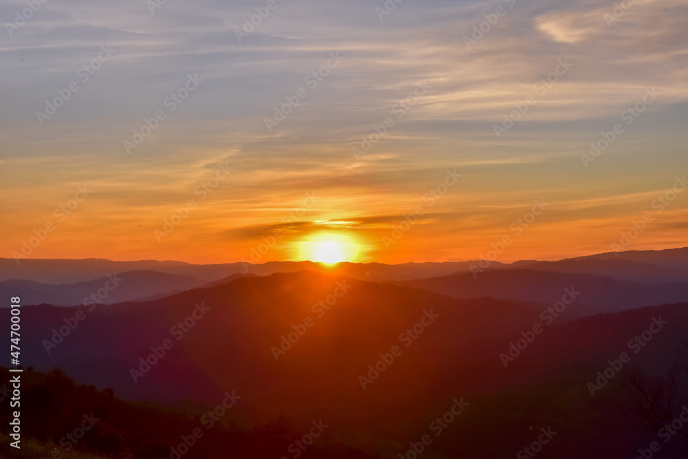 Colorful sunset over the mountain hills Thailand