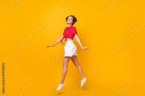 Full size profile photo of pretty friendly person beaming smile look camera isolated on yellow color background