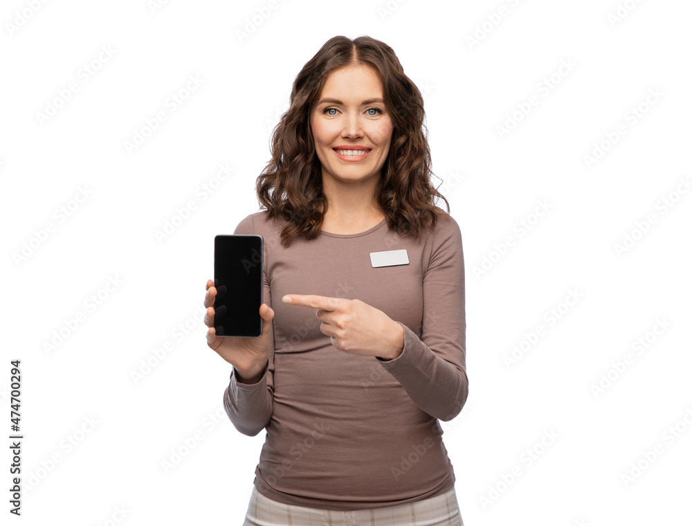 sale, shopping and business concept - happy female shop assistant with name tag showing smartphone over white background sale, shopping and business concept - happy female shop assistant with name tag showing smartphone over white background