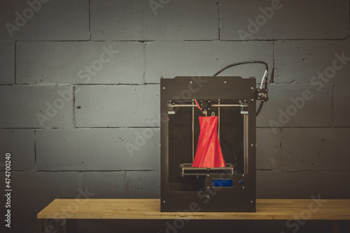 3D printer working close up. Automatic three dimensional 3d printer performs plastic. Modern 3D printer printing an object from the hot molten. Concept progressive additive technology for 3d printing. © mari1408