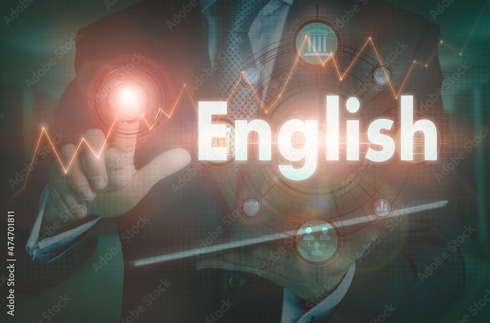 A businessman operating a computer display with a English business word concept on it.