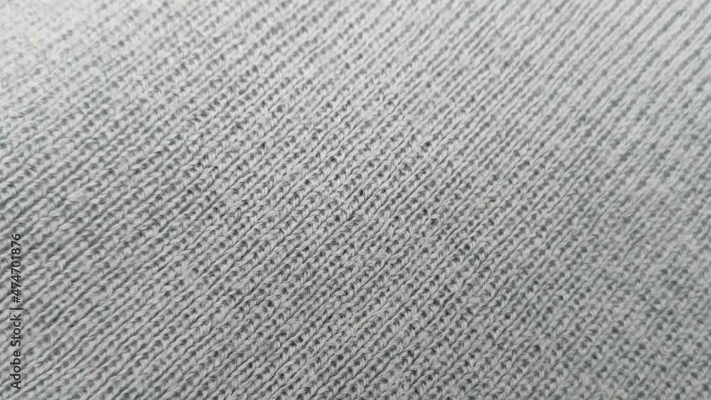 Knitted wool background. The real texture of the knitted fabric. Soft wool macro shooting. Rotation, close-up. Knitted wool background. The real texture of the knitted fabric. Soft wool macro shooting. Rotation, close-up.