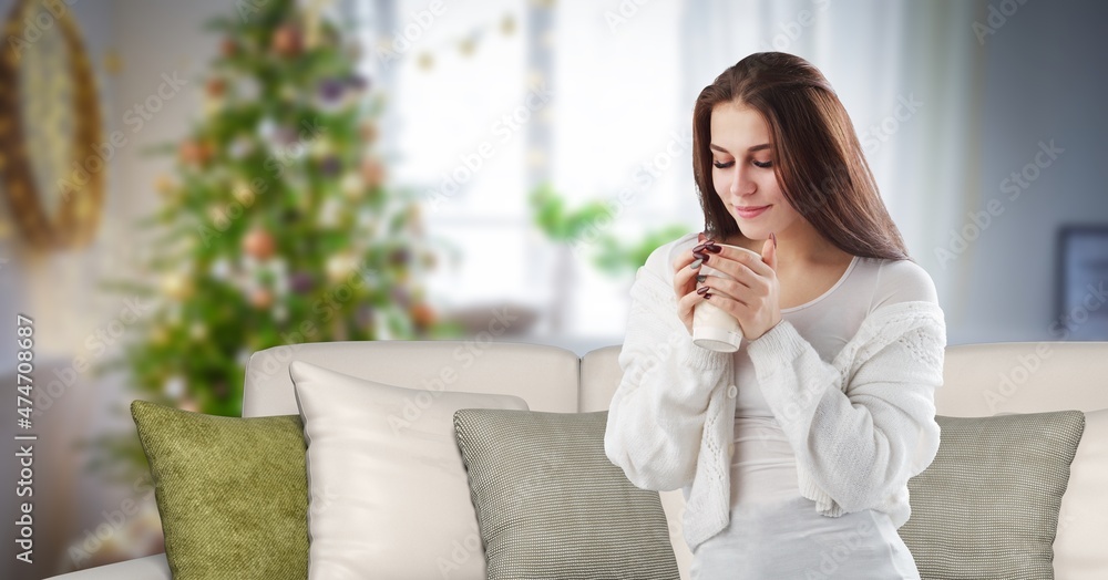 Photo of pretty dreamy young woman sitting couch drinking coffee indoors house home room Photo of pretty dreamy young woman sitting couch drinking coffee indoors house home room