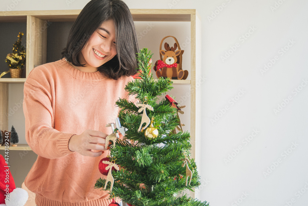 young asian woman prepare decorating for christmas and new year celebration