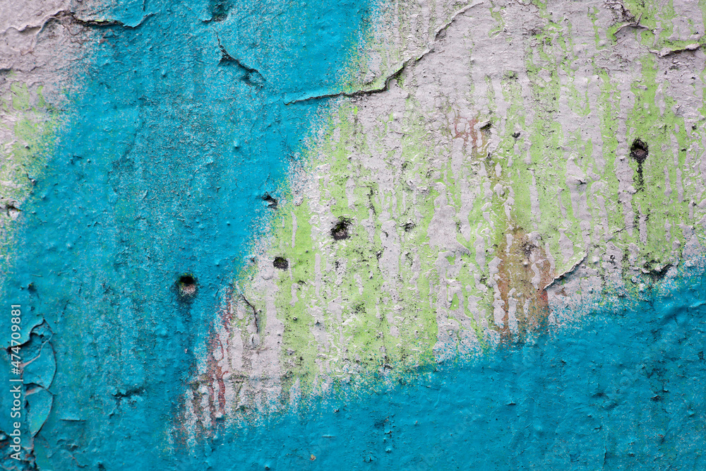 peeling blue paint  on a stone wall