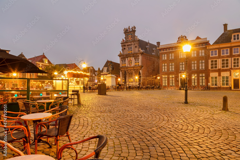 Fototapeta premium View at the Roode Steen city center square with christmas decoration in the Dutch city of Hoorn, The Netherlands