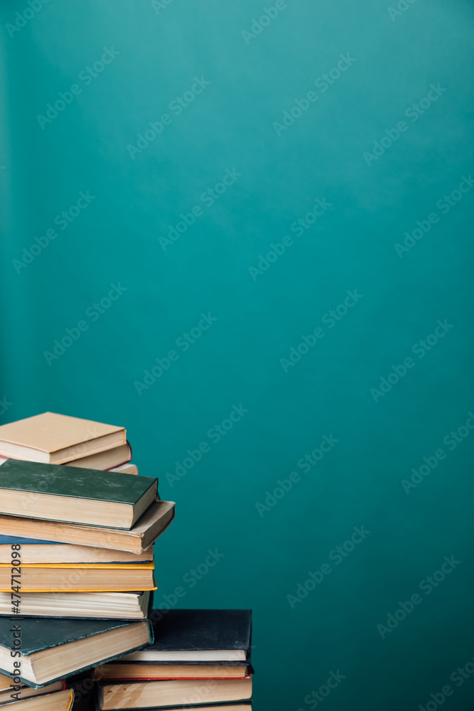 educational books for studying in the university library on a green background educational books for studying in the university library on a green background