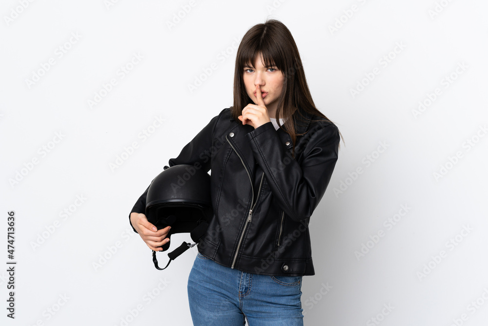 Fototapeta premium Woman holding a motorcycle helmet isolated on white background doing silence gesture