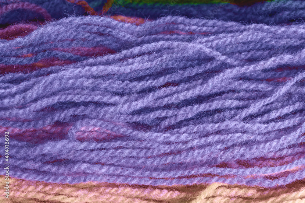 Wool yarn texture close-up in the colors of the year 2022.