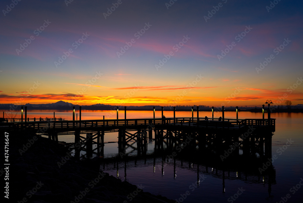 Fraser River Winter Twilight. Sunrise behind a fishing pier on the Fraser River. British Columbia, Canada. 


