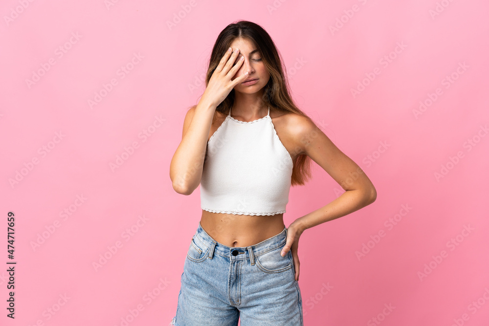 Young caucasian woman isolated on pink background with headache Young caucasian woman isolated on pink background with headache