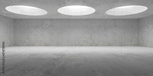 Empty modern abstract concrete room with light from circular ceiling openings and rough floor - industrial interior background template