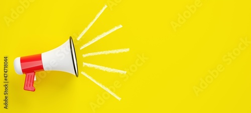 White and red megaphone or bullhorn with white lines over yellow background, business announcement or communication concept, flat lay top view from above photo