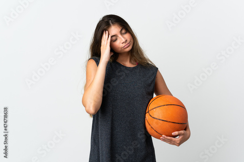 Young woman playing basketball isolated on white background with headache © luismolinero