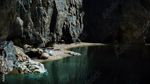 beach coast of the Norwegian Sea with mountains and cliffs on sunny day photo