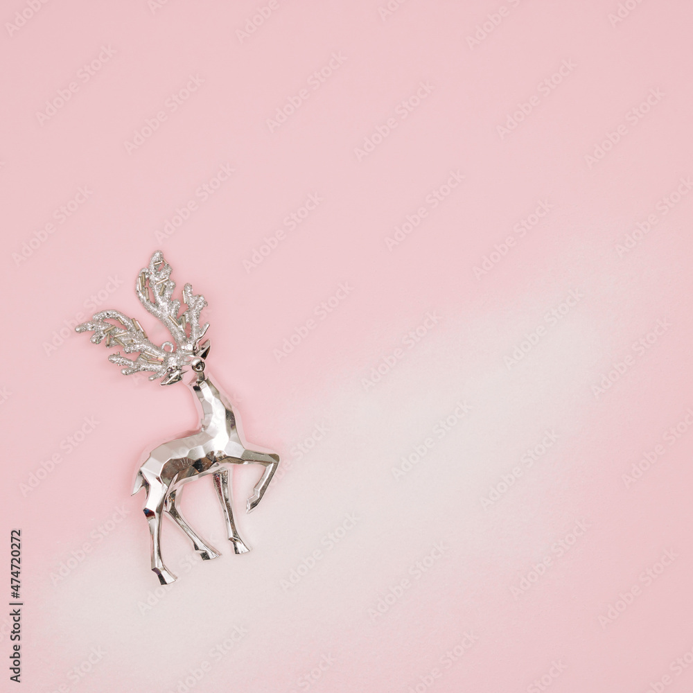 Santa reindeer on snow and pastel pink bacground. Winter holiday concept. New Year background. Santa reindeer on snow and pastel pink bacground. Winter holiday concept. New Year background.