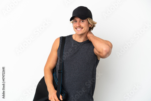 Young sport man with sport bag isolated on white background laughing