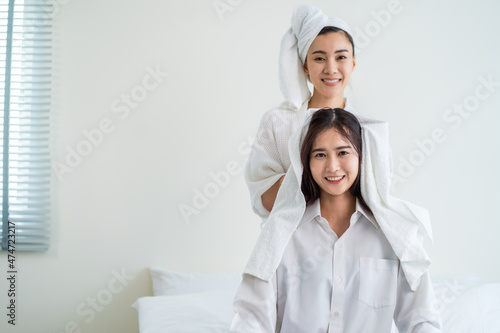 Asian beautiful lesbian couple spending morning leisure time together.
