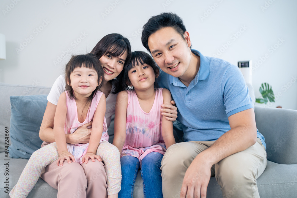 Portrait of Asian happy family spend time with kid together in house. Portrait of Asian happy family spend time with kid together in house.