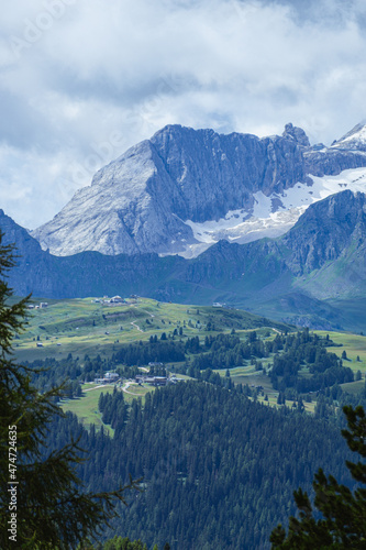 The marmolada, the highest peak of the dolomites, taken from the village of La villa, Alps, Italy - August 2021.