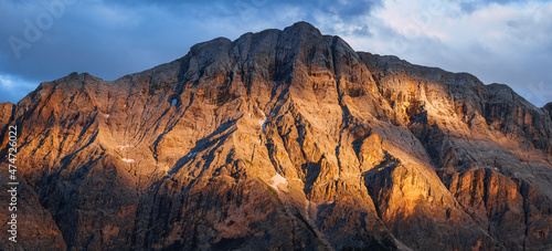 The mountain group "sas dla crusc", within the Unesco heritage area of the Dolomites, with the lights of the sunset, near the town of "la Villa", Italy - August 2