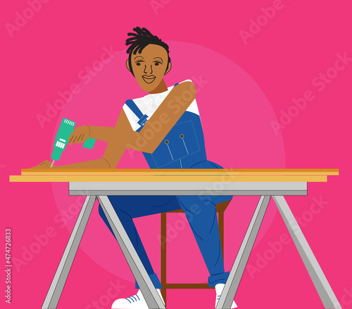 Lesbian carpenter drilling a hole in the wood