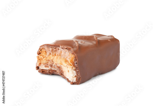 Piece of chocolate bar with caramel, nuts and nougat isolated on white