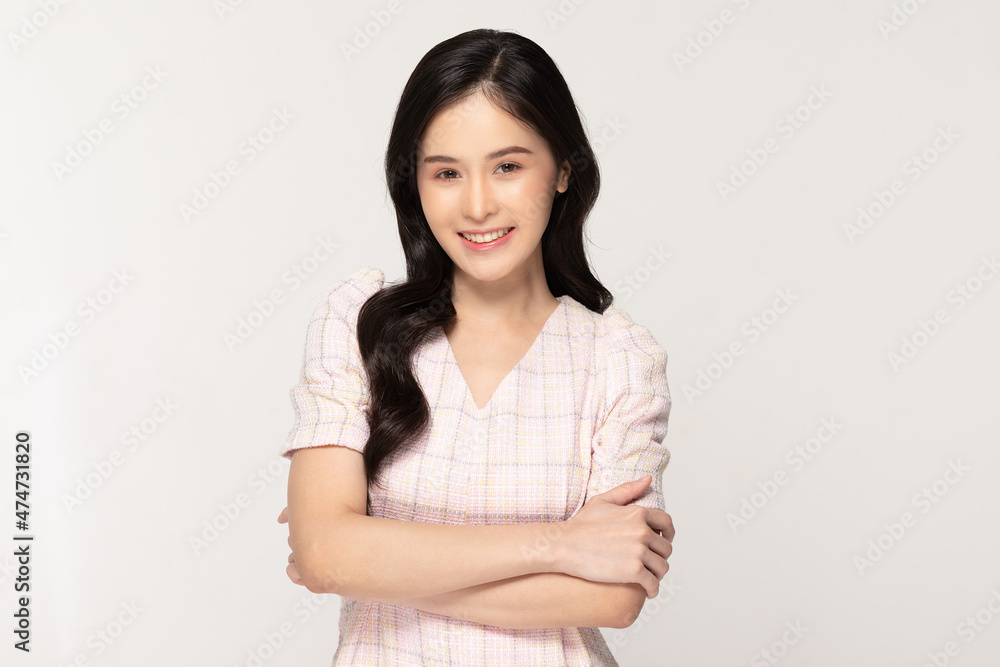 Attractive asian young woman smile and crossed arm isolated on white background happiness and successful.Cheerful pretty girl wear casual dress crossed arm looking at camera confident and smart Attractive asian young woman smile and crossed arm isolated on white background happiness and successful.Cheerful pretty girl wear casual dress crossed arm looking at camera confident and smart