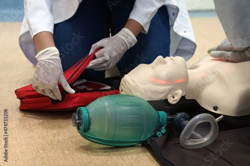 Chest compressions by a student on a simulation dummy during basic life support with an automatic external defibrillator. Simulation training scenario
