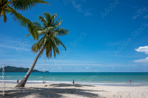 Unrecognizable people enjoy Patong Beach during the covid-19 pandemic in November 2021 in Phuket  Thailand.