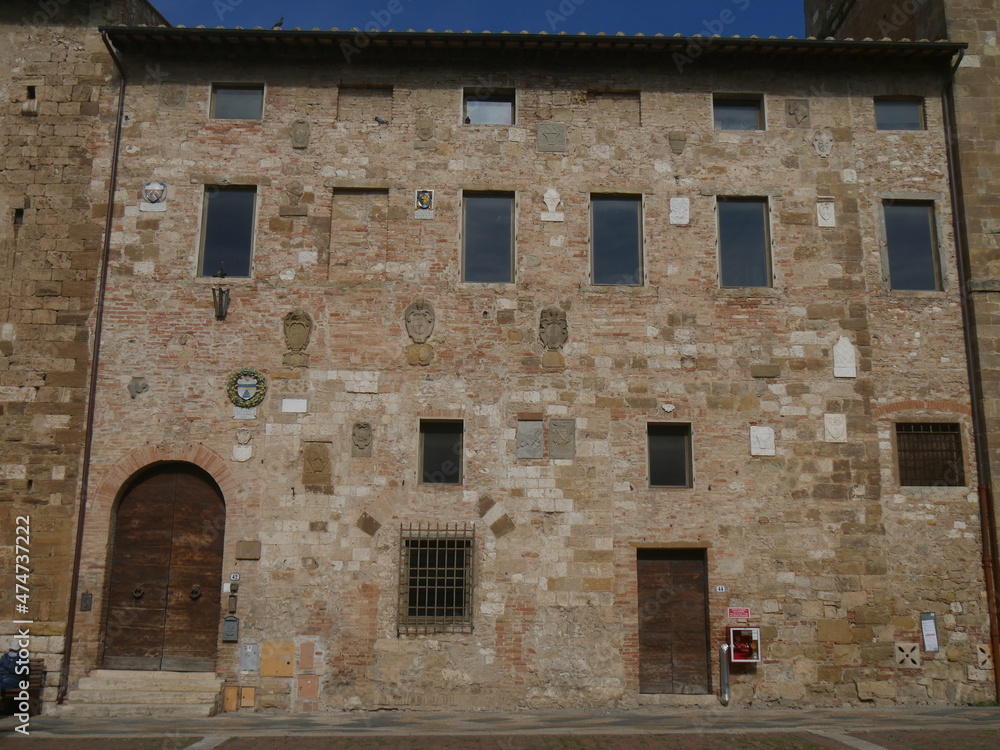 Podestà palace of Colle di Val d'Elsa with the heraldic coats of arms of the Podestà on the facade