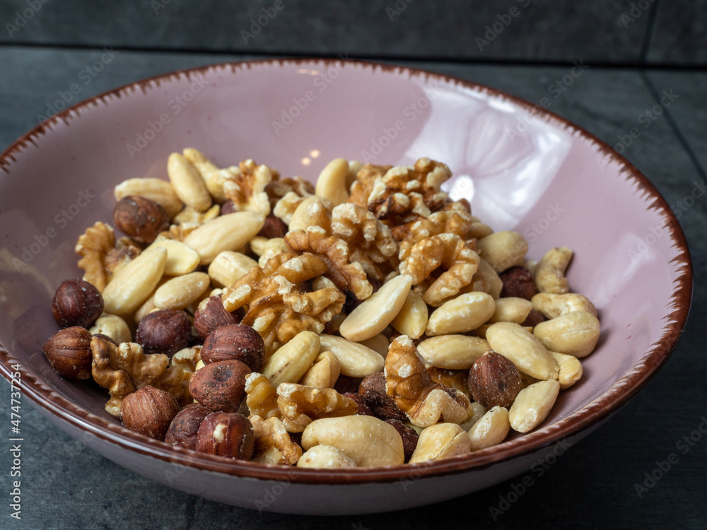 Mix nuts on a wooden background. Mix nuts on a wooden background.