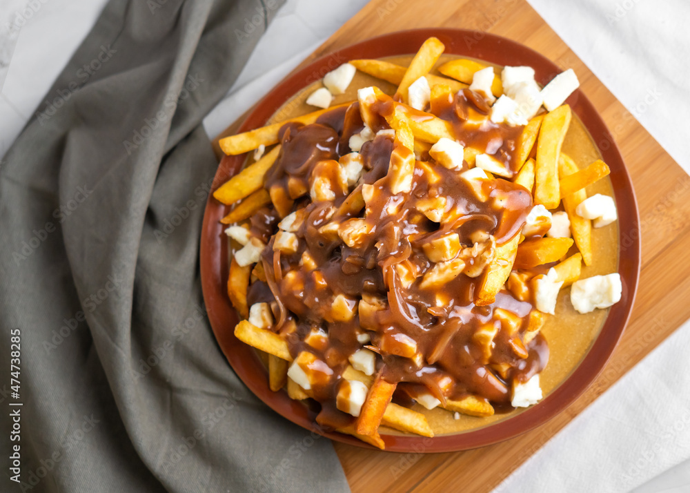 The original poutine with fresh cheese curds and hot gravy melted to