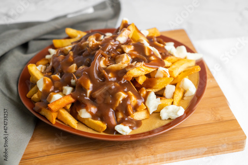The original poutine with fresh cheese curds and hot gravy melted to perfection  photo