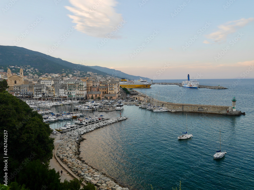 Corsica, France, 25.07.2020. Old town and harbor of Bastia seen from the citadel at sunset. 