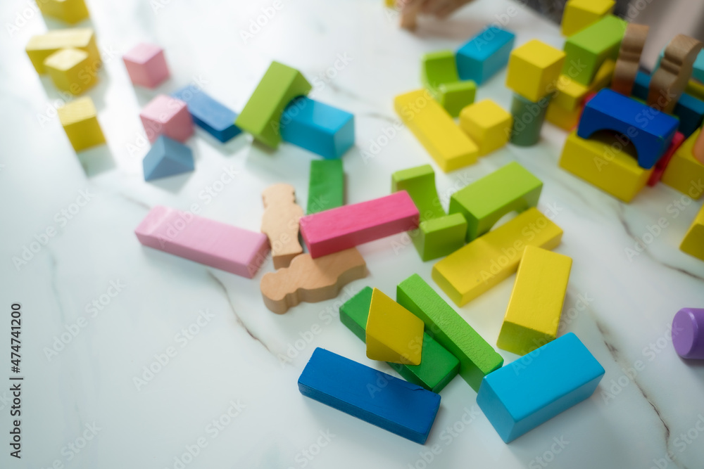 Top view creative photo building game pieces of kids organize toys in various shape on floor background,Happy children. Top view creative photo building game pieces of kids organize toys in various shape on floor background,Happy children.