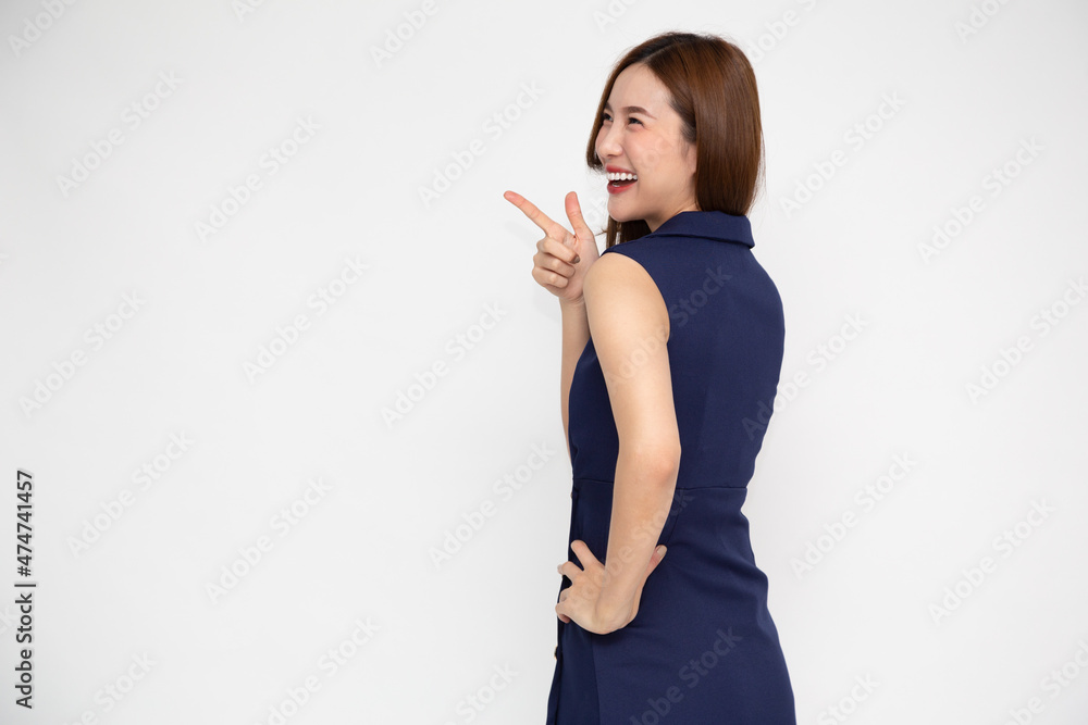 Young elegant beautiful Asian woman turn around and pointing to empty copy space isolated on white background Young elegant beautiful Asian woman turn around and pointing to empty copy space isolated on white background