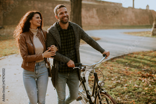Young couple walking with b...