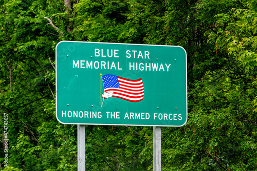 US route 1 Blue Star memorial highway sign honoring the armed forces military army veterans on road in North Carolina with American flag photo